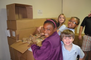 Canterbury third graders helping at BackPack Beginnings. 